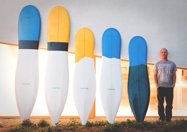 Photo of Thomas Meyerhoffer with surfboard designs